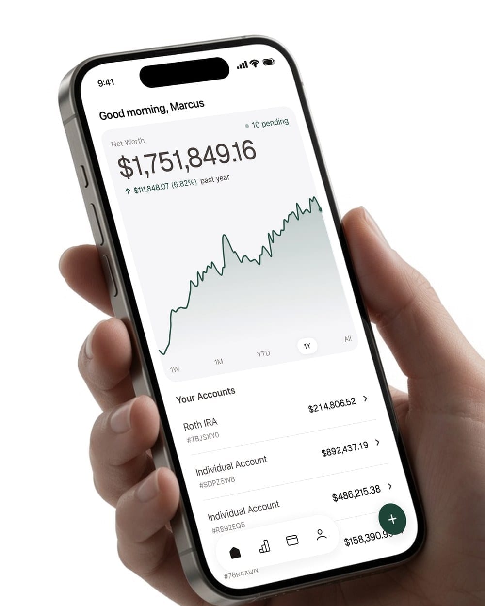 A hand holding a phone with the alooola app open to net worth, performance over the past year and account balances
